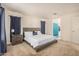 Spacious primary bedroom with large bed, bedside table, ensuite bathroom, and walk-in closet at 4044 S 58Th Ln, Phoenix, AZ 85043
