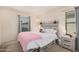 Bedroom features include a queen bed, nightstands, carpet, and a large window at 4044 S 58Th Ln, Phoenix, AZ 85043
