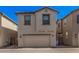 Front exterior of home featuring an attached garage, neutral color scheme, and low maintenance landscaping at 4044 S 58Th Ln, Phoenix, AZ 85043