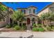 Charming two-story home with a well-manicured front yard and a welcoming red door at 4044 S 58Th Ln, Phoenix, AZ 85043