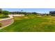 Community green space offers a large grassy area with walking path, perfect for outdoor activities at 4044 S 58Th Ln, Phoenix, AZ 85043