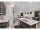 Bright open-concept kitchen seamlessly connects to the living and dining areas at 4044 S 58Th Ln, Phoenix, AZ 85043