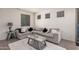 Comfortable living room showcasing a cozy sectional sofa with throw pillows and modern decor at 4044 S 58Th Ln, Phoenix, AZ 85043