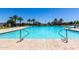 Community pool with crystal clear water and poolside seating is perfect for summer relaxation at 4044 S 58Th Ln, Phoenix, AZ 85043