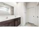 Bright bathroom featuring double sinks, subway tile shower, and modern finishes at 42920 W Palo Amarillo Rd, Maricopa, AZ 85138