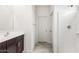 Well-lit bathroom featuring sleek fixtures, modern design and tiled shower at 42920 W Palo Amarillo Rd, Maricopa, AZ 85138