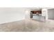 Open kitchen featuring an island, stainless steel appliances, and tile floors at 42920 W Palo Amarillo Rd, Maricopa, AZ 85138