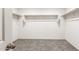 Walk-in closet with shelving for optimal storage and carpeted flooring at 42920 W Palo Amarillo Rd, Maricopa, AZ 85138