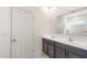 Bright bathroom with double sinks, large mirror, and easy access to a convenient shower at 42960 W Palo Amarillo Rd, Maricopa, AZ 85138