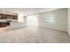 Bright, open floor plan showcasing the kitchen and living areas, with tile flooring throughout at 42960 W Palo Amarillo Rd, Maricopa, AZ 85138
