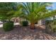 Single-Gathering home featuring a two-car garage and well-manicured landscaping at 44158 W Canyon Creek Dr, Maricopa, AZ 85139
