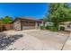 Single-Gathering home featuring a two-car garage and a spacious driveway at 44158 W Canyon Creek Dr, Maricopa, AZ 85139