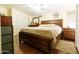 Well-lit bedroom with a spacious layout, ceiling fan, wood flooring, and ample natural light at 501 E Ray Rd # 36, Chandler, AZ 85225