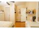 Bedroom with wood floors, ceiling fan, and a comfortable bed, offering a cozy and serene space at 501 E Ray Rd # 36, Chandler, AZ 85225