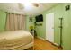 Cozy bedroom with a ceiling fan, wood floors, and a comfortable bed, offering a serene retreat at 501 E Ray Rd # 36, Chandler, AZ 85225
