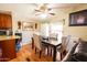 Cozy dining area featuring a modern table set, ceiling fan, and natural light at 501 E Ray Rd # 36, Chandler, AZ 85225