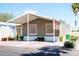 Charming home featuring desert landscaping, covered parking, and a welcoming facade at 501 E Ray Rd # 36, Chandler, AZ 85225