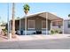 Charming home featuring desert landscaping, covered parking, and a welcoming facade at 501 E Ray Rd # 36, Chandler, AZ 85225