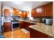 Modern kitchen featuring stainless steel appliances, granite countertops, and ample cabinetry at 501 E Ray Rd # 36, Chandler, AZ 85225