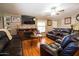 Cozy living room featuring hardwood floors, comfortable seating, and natural light at 501 E Ray Rd # 36, Chandler, AZ 85225