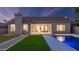 View of the home's manicured lawn and inground pool, perfect for outdoor enjoyment at 5103 E Juniper Ave, Scottsdale, AZ 85254