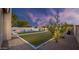 Picturesque backyard with well-maintained landscaping, lighting and a sparkling pool at 5103 E Juniper Ave, Scottsdale, AZ 85254
