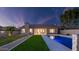 Exterior of home with manicured lawn and stunning pool, perfect for outdoor enjoyment at 5103 E Juniper Ave, Scottsdale, AZ 85254