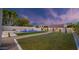 Beautiful backyard with a sparkling pool and a well-maintained artificial grass at 5103 E Juniper Ave, Scottsdale, AZ 85254