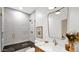 Modern bathroom features a glass shower and vanity with bronze faucet and hardware at 5103 E Juniper Ave, Scottsdale, AZ 85254