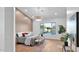 Bright primary bedroom featuring hardwood floors, modern lighting, and a textured accent wall at 5103 E Juniper Ave, Scottsdale, AZ 85254