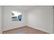 Bright bedroom features a large window and hardwood floors at 5103 E Juniper Ave, Scottsdale, AZ 85254
