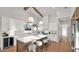Well-lit kitchen features a spacious island with barstool seating and white cabinets at 5103 E Juniper Ave, Scottsdale, AZ 85254