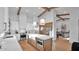Bright, modern kitchen with an island, stainless steel appliances, and wooden beam accents at 5103 E Juniper Ave, Scottsdale, AZ 85254