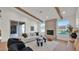 Elegant living room with a cozy fireplace, comfortable seating, and natural light at 5103 E Juniper Ave, Scottsdale, AZ 85254