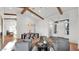 Open-concept living space with elegant furniture, dining area, and front door views at 5103 E Juniper Ave, Scottsdale, AZ 85254