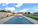 Swimming pool with travertine patio, fountain feature, gravel landscaping, and a grassy area at 5103 E Juniper Ave, Scottsdale, AZ 85254