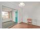 Bright bedroom featuring hardwood floors and a sliding closet door at 5317 E Colby St, Mesa, AZ 85205