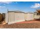 View of the yard with two storage sheds, low-maintenance landscaping, and a serene outdoor space at 5317 E Colby St, Mesa, AZ 85205