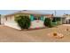 Charming home exterior featuring an American flag, desert landscaping, and a well-maintained front yard at 5317 E Colby St, Mesa, AZ 85205