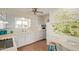 Bright kitchen featuring white cabinets, breakfast bar and a charming mural at 5317 E Colby St, Mesa, AZ 85205