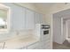 Bright kitchen featuring white cabinets and a retro-style oven at 5317 E Colby St, Mesa, AZ 85205