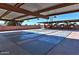 Covered shuffleboard courts providing shade and comfort for players, surrounded by well-kept grounds at 5317 E Colby St, Mesa, AZ 85205