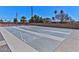 Outdoor shuffleboard courts with clearly marked playing areas surrounded by green spaces at 5317 E Colby St, Mesa, AZ 85205