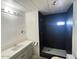 Bathroom featuring a stylish vanity with an undermount sink and a modern tiled shower at 535 S Alma School Rd # 37, Mesa, AZ 85210