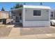 Single-story home featuring a covered porch and gravel landscaping at 535 S Alma School Rd # 37, Mesa, AZ 85210