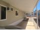 Covered parking space with beige siding and a window air conditioning unit at 535 S Alma School Rd # 37, Mesa, AZ 85210