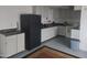Kitchen with white cabinets and classic black appliances at 535 S Alma School Rd # 37, Mesa, AZ 85210