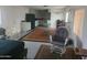 Open-concept living area with bright walls, vintage style, and modern appliances at 535 S Alma School Rd # 37, Mesa, AZ 85210