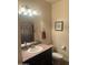 A well-maintained bathroom features a vanity, mirror, toilet, and decorative accents at 5350 E Deer Valley Dr # 3267, Phoenix, AZ 85054