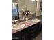 Bathroom with double sinks, stylish countertop, and decorative tile backsplash at 5350 E Deer Valley Dr # 3267, Phoenix, AZ 85054